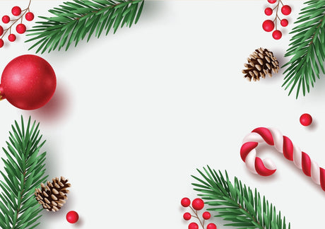 Christmas-themed decorations including red baubles, green pine branches, and a candy cane on a white background.