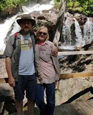 Heather and Blair from Annanda chaga in Nature by waterfall